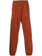 A-cold-wall* Overlock Nylon Track Pants - Orange