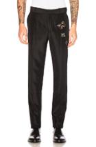 Alexander Mcqueen Embroidered Trousers In Black