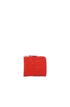 Comme Des Garcons Star Embossed Small Zip Wallet In Orange,geometric Print