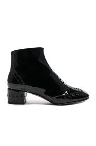 Chloe Perry Patent Leather Ankle Boots In Black