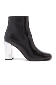 Saint Laurent Leather Babies Pin Boots In Black