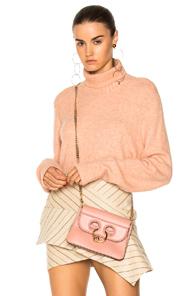 Frame Denim Slouchy Turtleneck Sweater In Neutrals,pink