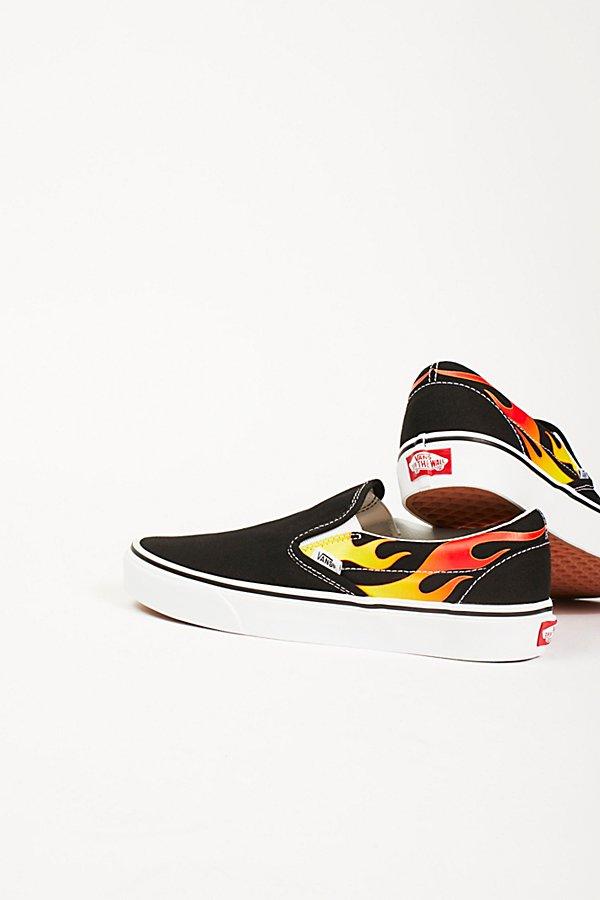 Flame Classic Slip-on Sneakers By Vans At Free People