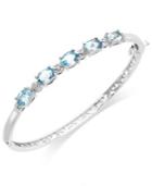 Blue Topaz (5-1/2 Ct. T.w.) And Diamond Accent Bangle Bracelet In Sterling Silver Plate