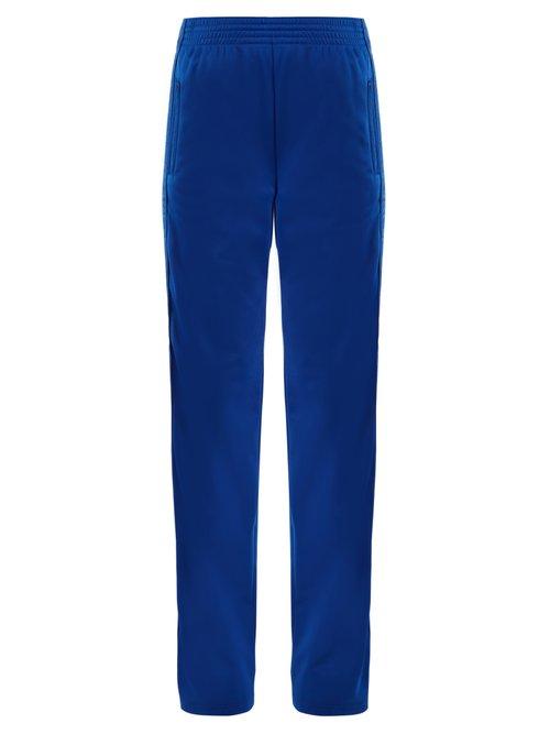 Matchesfashion.com Givenchy - Logo Print High Rise Jersey Trousers - Womens - Blue