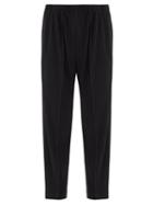 Homme Pliss Issey Miyake - Technical-pleated Tapered-leg Trousers - Mens - Black