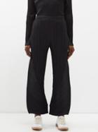Pleats Please Issey Miyake - Technical-pleated Curved-leg Trousers - Womens - Black