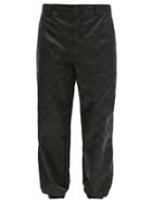 Matchesfashion.com Gucci - Stirrup-cuff Gg-print Technical Trousers - Mens - Black