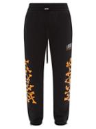 Amiri - Bone-print Cotton-jersey Track Pants - Mens - Black Orange