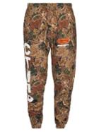 Matchesfashion.com Heron Preston - Ctnmb Leaf Print Cotton Jersey Track Pants - Mens - Khaki