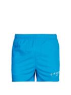 Matchesfashion.com Givenchy - Logo Printed Swim Shorts - Mens - Blue
