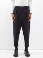 Ami - Pleated Cotton Carrot-leg Trousers - Mens - Black