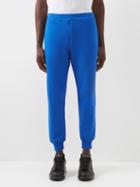 Alexander Mcqueen - Graffiti-logo Cotton-jersey Track Pants - Mens - Black Blue