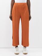 Pleats Please Issey Miyake - Side-slit Technical-pleated Trousers - Womens - Orange