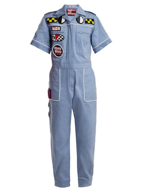Matchesfashion.com Miu Miu - Badge Appliqu Cotton Blend Jumpsuit - Womens - Light Blue