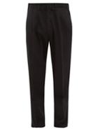 Matchesfashion.com The Gigi - Tapered Herringbone Cotton Blend Trousers - Mens - Black
