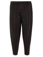 Homme Pliss Issey Miyake - Technical-pleated Tapered Trousers - Mens - Black