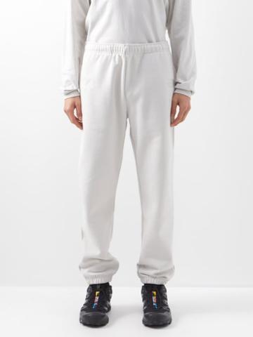 The North Face Xx Kaws - Logo-embroidered Cotton-blend Track Pants - Mens - Ivory