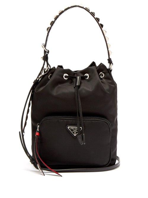 Matchesfashion.com Prada - New Vela Studded Nylon Bucket Bag - Womens - Black Red