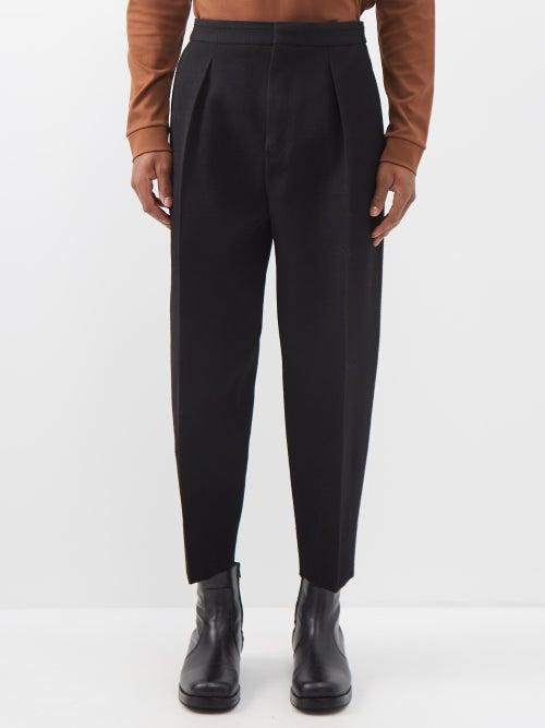 Zegna - Pleated Wool Carrot-leg Trousers - Mens - Black