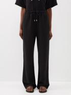 Toteme - Drawstring-waist Lyocell-blend Trousers - Womens - Black