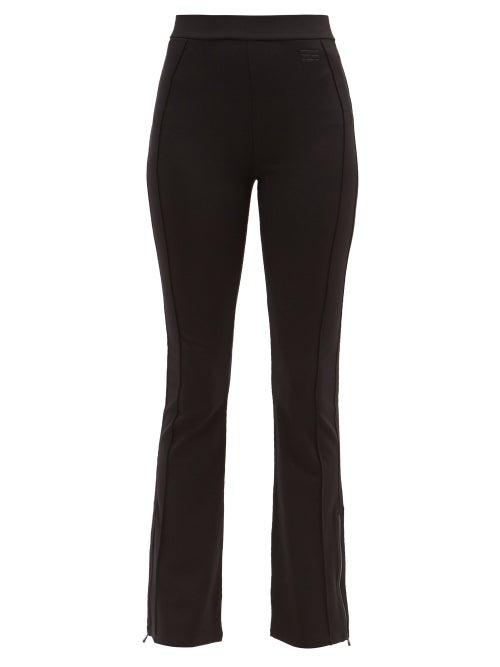 Frame - High-rise Zipped-cuff Flared Jersey Trousers - Womens - Black
