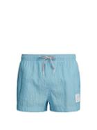 Matchesfashion.com Thom Browne - Logo Patch Striped Seersucker Swim Shorts - Mens - Light Blue
