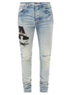 Matchesfashion.com Amiri - Varsity-appliqu Distressed Slim-leg Jeans - Mens - Blue