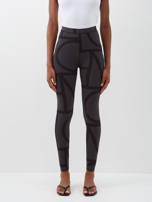 Toteme - Monogram-print Jersey Leggings - Womens - Black Multi