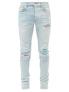 Matchesfashion.com Amiri - Printed-patch Distressed Slim-leg Jeans - Mens - Blue