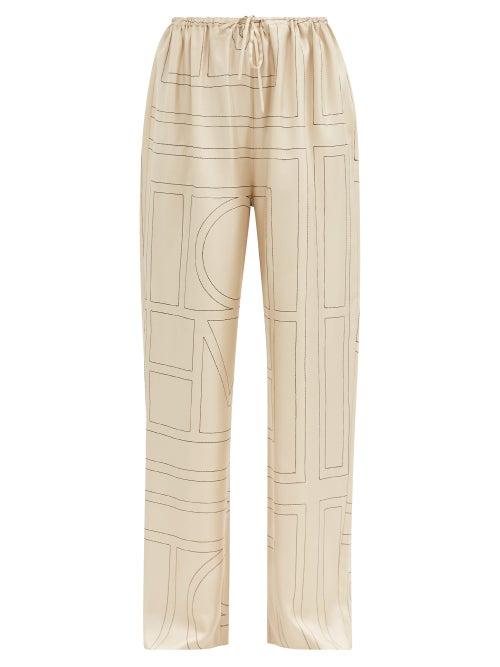 Matchesfashion.com Totme - Vizelle Logo-embroidered Silk-twill Trousers - Womens - Ivory