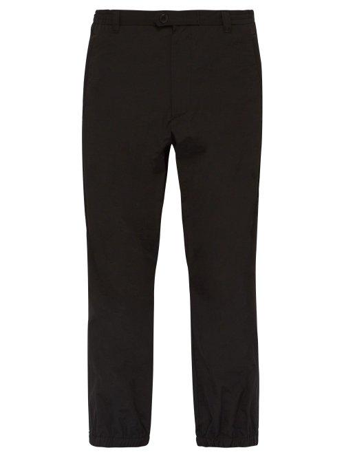 Matchesfashion.com Prada - Hammered Nylon Zipped Cuff Trousers - Mens - Black