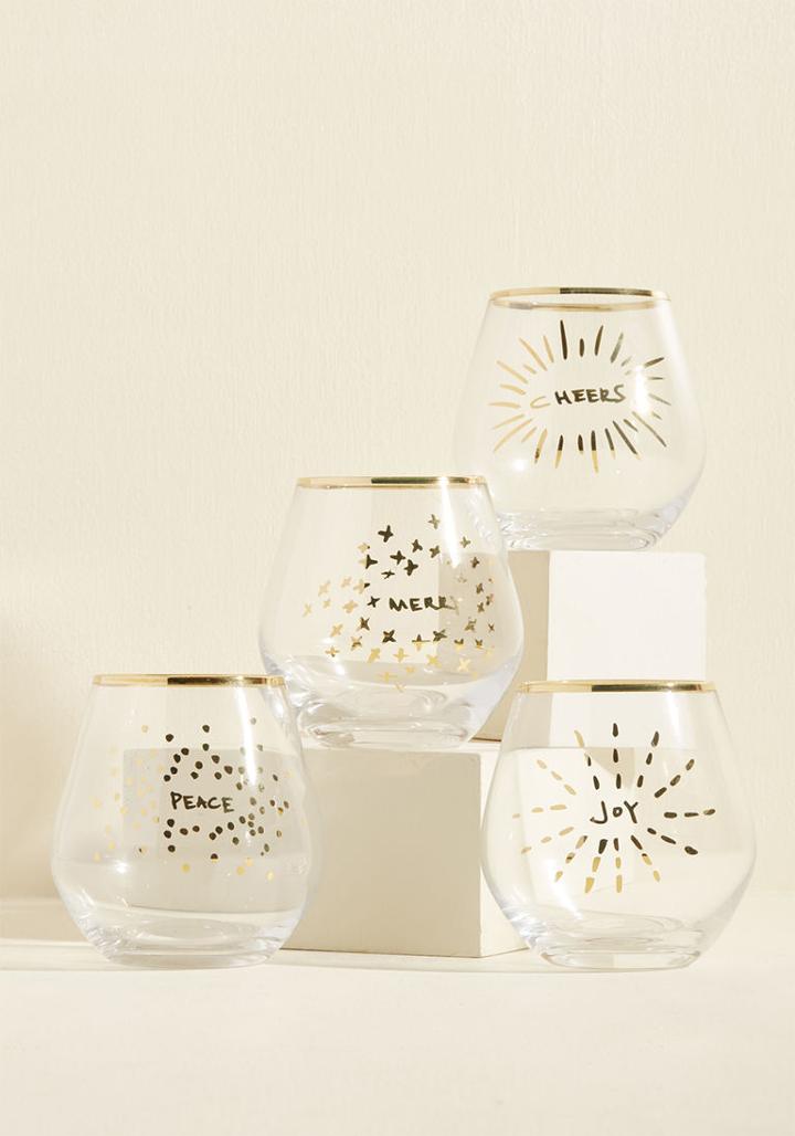 207729 This Set Of Four Stemless Wine Glasses Is Stylishly Equipped With Ideas Of Sentiments To Toast! Furbished With Golden Rims And Festive Exclamations Adorned With Delightful Doodles, This Quad Makes Cocktail Hour Feel All The More Celebratory.