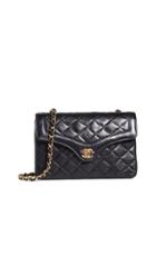 What Goes Around Comes Around Chanel Black Lamb Round Tab Flap Small Bag