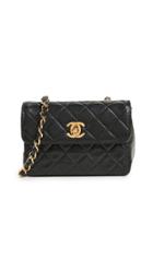 What Goes Around Comes Around Chanel Lambskin Half Flap Micro Bag