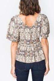  Button-back Peplum Top