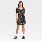 Girls' Puff Short Sleeve Printed Woven Romper - Art Class Black Daisy