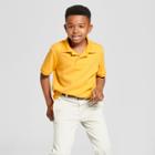 Boys' Short Sleeve Interlock Uniform Polo Shirt - Cat & Jack Mustard Yellow