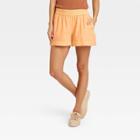 Women's High-rise Pull-on Shorts - A New Day Light Orange
