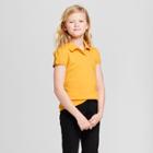 Girls' Short Sleeve Interlock Uniform Polo Shirt - Cat & Jack Mustard Yellow