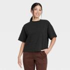 Women's Bell Short Sleeve Quilted Boxy T-shirt - A New Day Black
