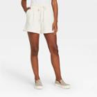 Women's High-rise Tie Waist Knit Lounge Shorts - A New Day Cream
