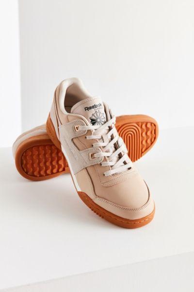Urban Outfitters Reebok Workout Lo Plus Golden Sneaker