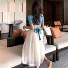 Open Back Short-sleeve Crop Top / High-waist A-line Skirt