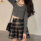 Long-sleeve Cross-strap Single-breasted Top / High-waist Plaid Pleated Skirt