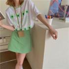 Short-sleeve Floral Lettering T-shirt / High-waist Plain A-line Skirt