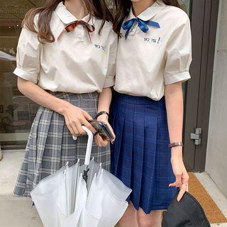 Short-sleeve Ribbon Top / Plaid A-line Mini Pleated Skirt
