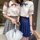Short-sleeve Ribbon Top / Plaid A-line Mini Pleated Skirt