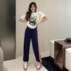 Short-sleeve Cartoon Print T-shirt / Striped Harem Pants