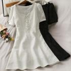 Embossed Lace-up Mini Dress